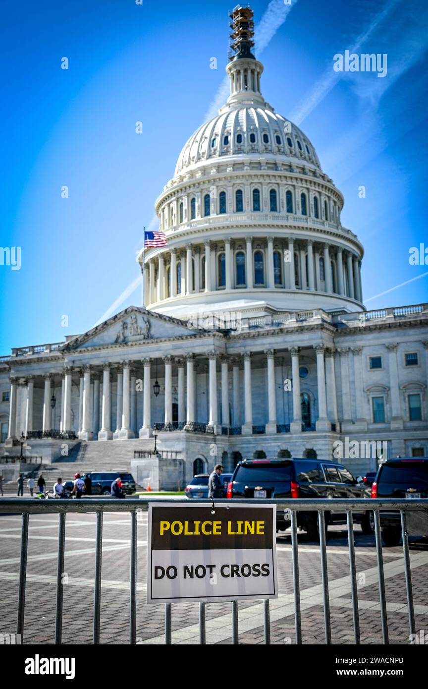 Police Line Do Not Cross sign on barrier gate in front of the US Capitol building, Washington, DC, USA Stock Photo