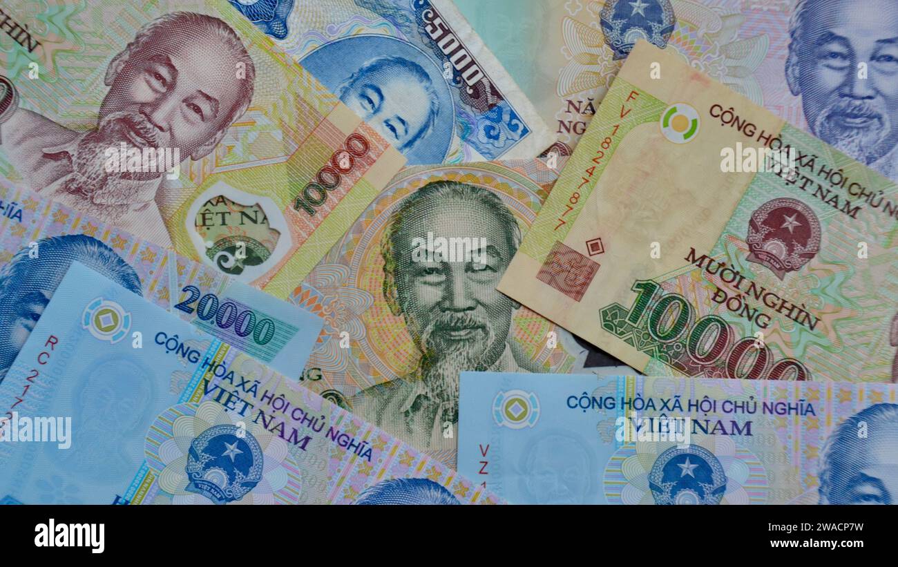 Concept for finance, wealth and currency exchange with a full frame image of Vietnam Dong showing the face of famed politician and leader Ho Chi Minh Stock Photo