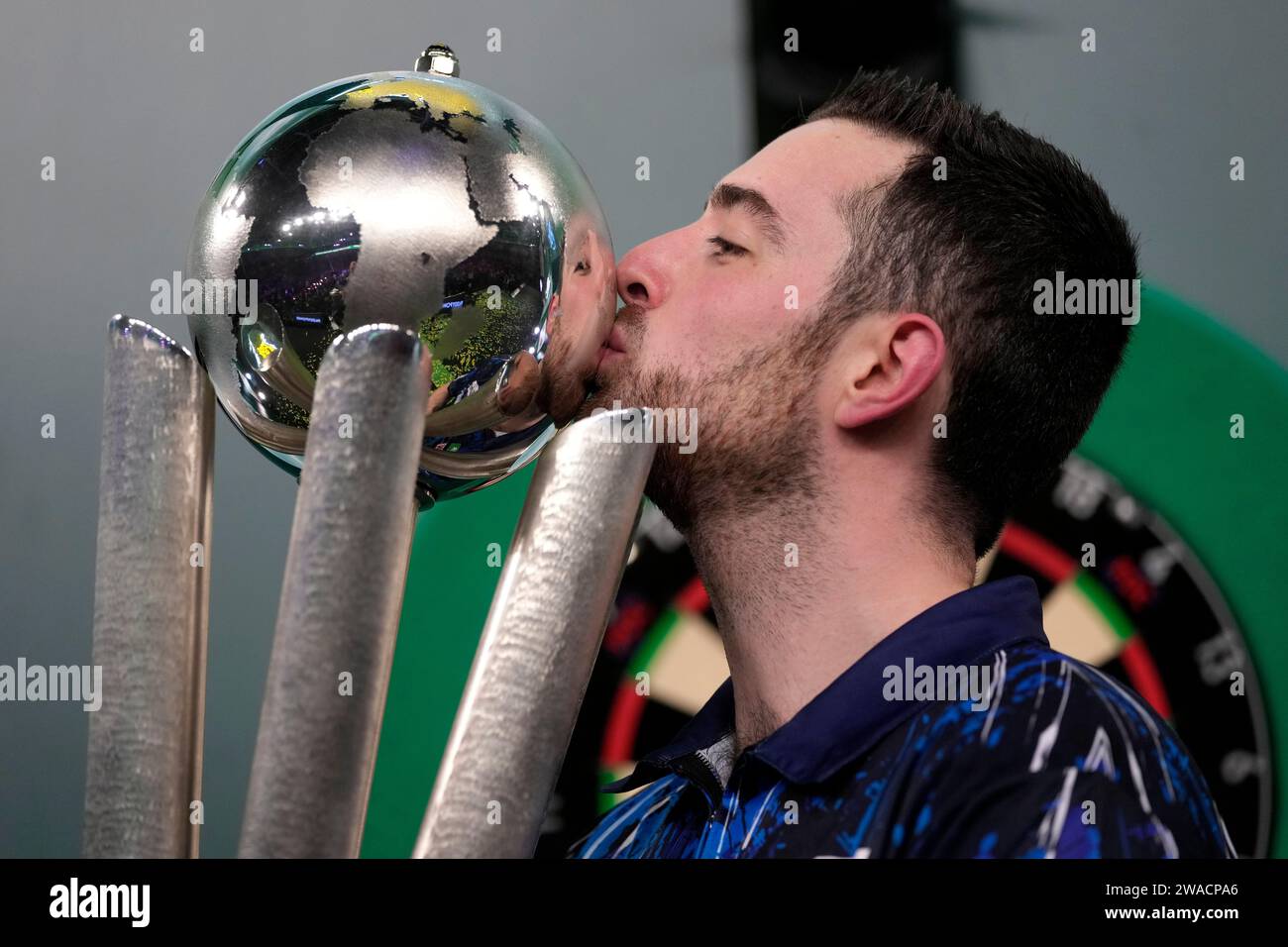 Luke Humphries Of England Kisses The Trophy After Winning The Final