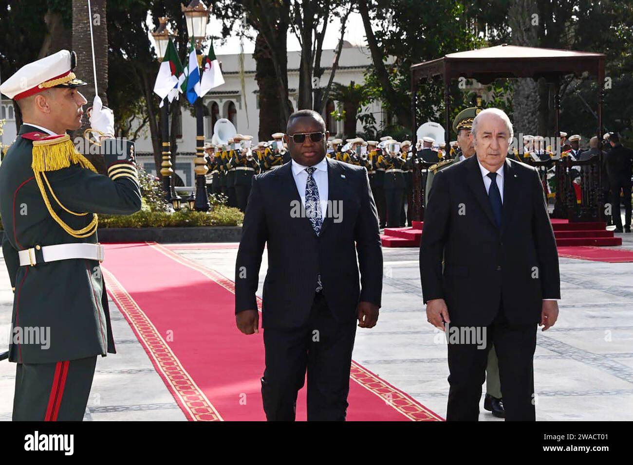 (240103) -- ALGIERS, Jan. 3, 2024 (Xinhua) -- Algerian President Abdelmadjid Tebboune (1st R, Front) welcomes Sierra Leonean President Julius Maada Bio (2nd R, Front) in Algiers, Algeria, on Jan. 3, 2024. Algeria and Sierra Leone affirmed on Wednesday their commitment to closely collaborate in upholding international peace and security in accordance with the UN Charter and international law. (Algerian Presidency/Handout via Xinhua) Stock Photo