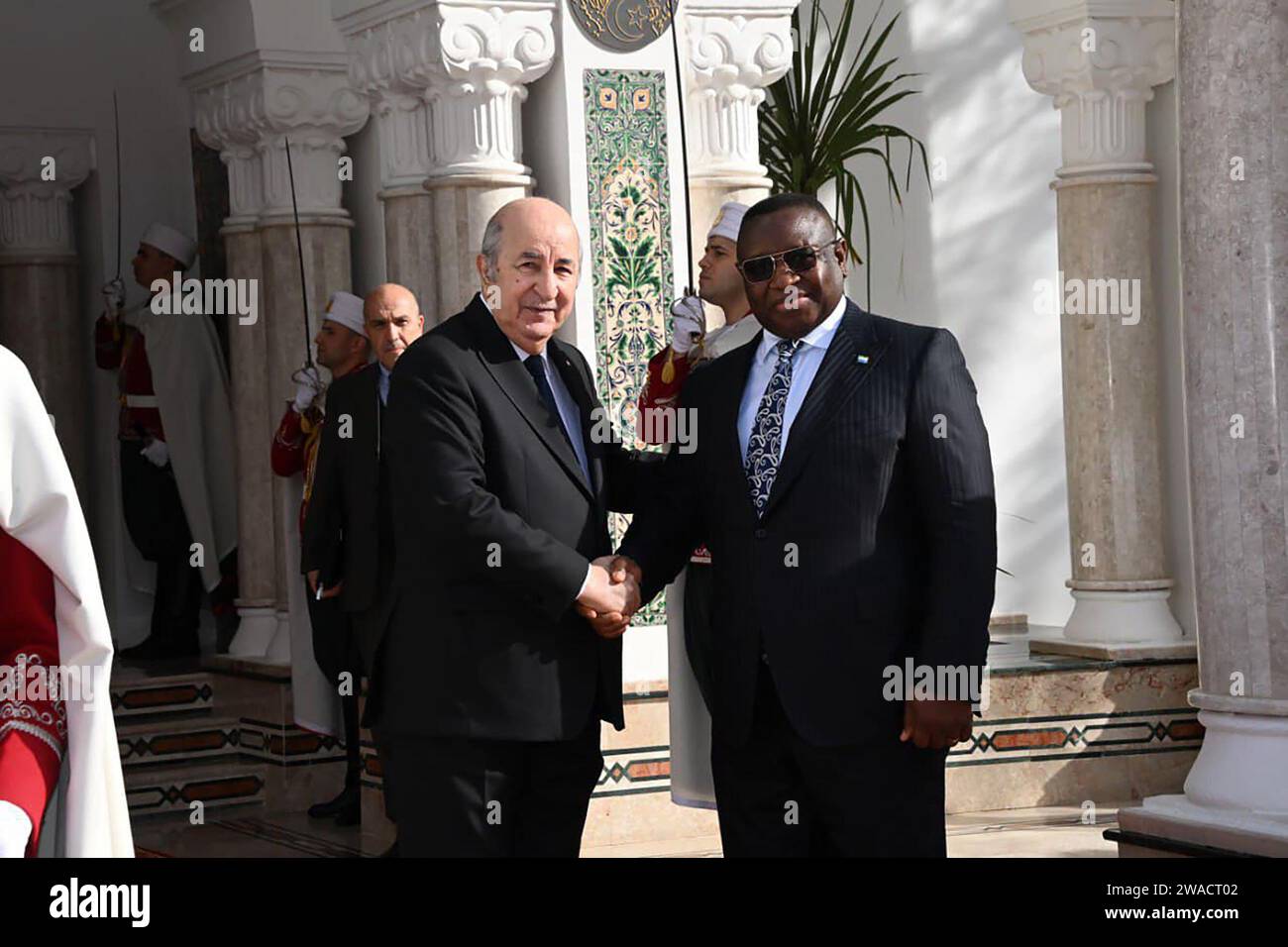 (240103) -- ALGIERS, Jan. 3, 2024 (Xinhua) -- Algerian President Abdelmadjid Tebboune (C-L) welcomes Sierra Leonean President Julius Maada Bio (C-R) in Algiers, Algeria, on Jan. 3, 2024. Algeria and Sierra Leone affirmed on Wednesday their commitment to closely collaborate in upholding international peace and security in accordance with the UN Charter and international law. (Algerian Presidency/Handout via Xinhua) Stock Photo