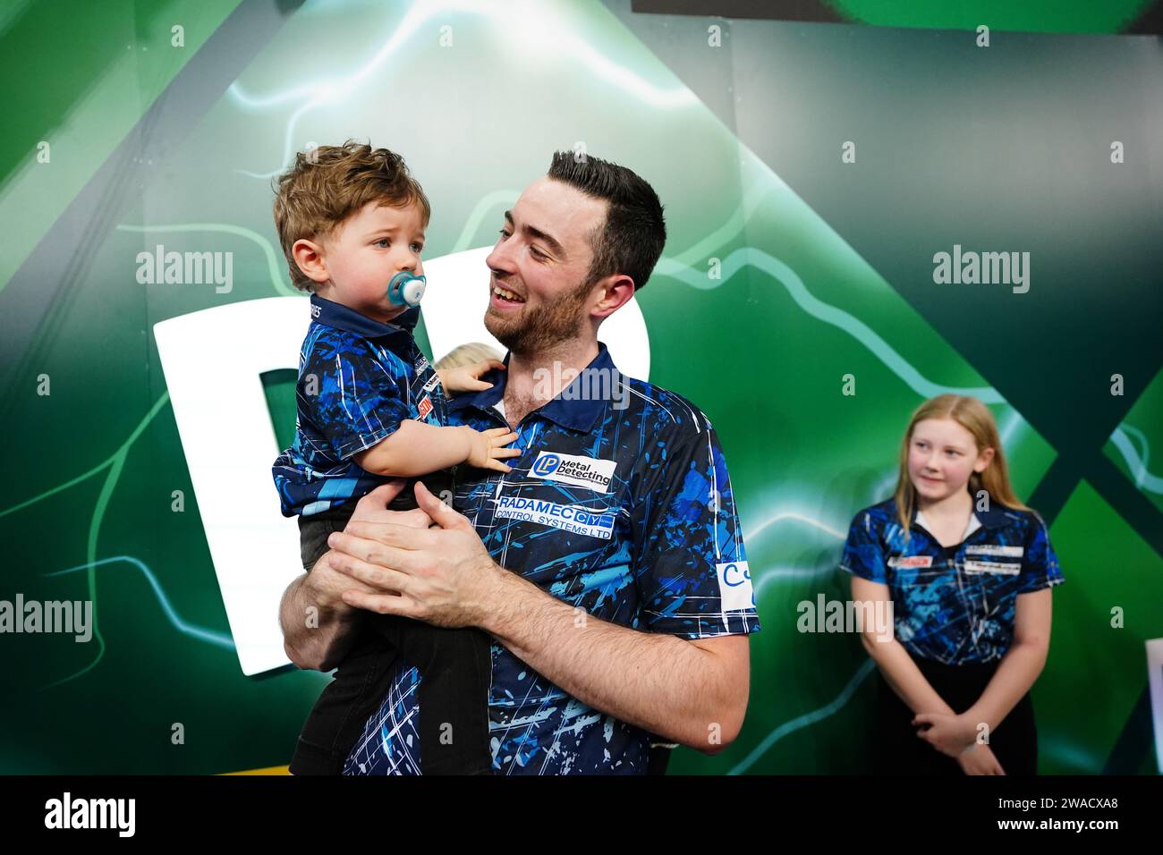 Luke Humphries celebrates with family after victory over Luke Littler