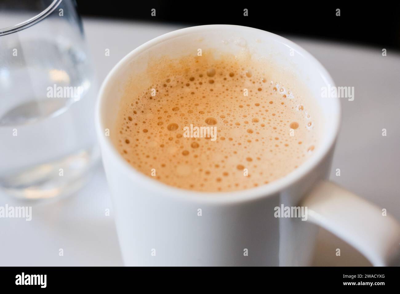 A mug of teh tarik (Malaysian pulled tea with evaporated or condensed milk), served on a business class en route to Kuala Lumpur from Sydney Stock Photo
