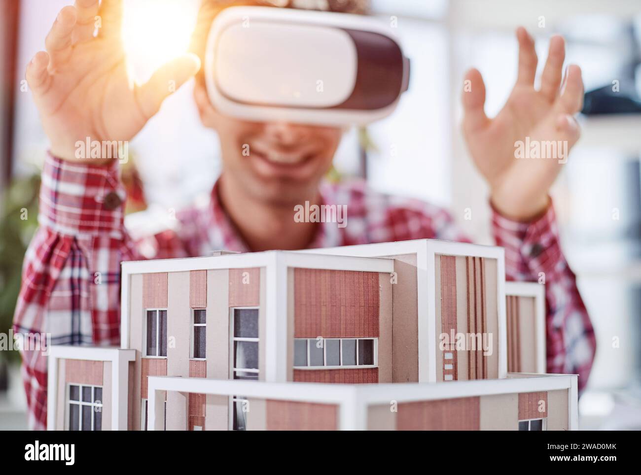 Virtual reality futuristic design technology. Architect or design engineer in VR headset for BIM technology designing a 3D model Stock Photo