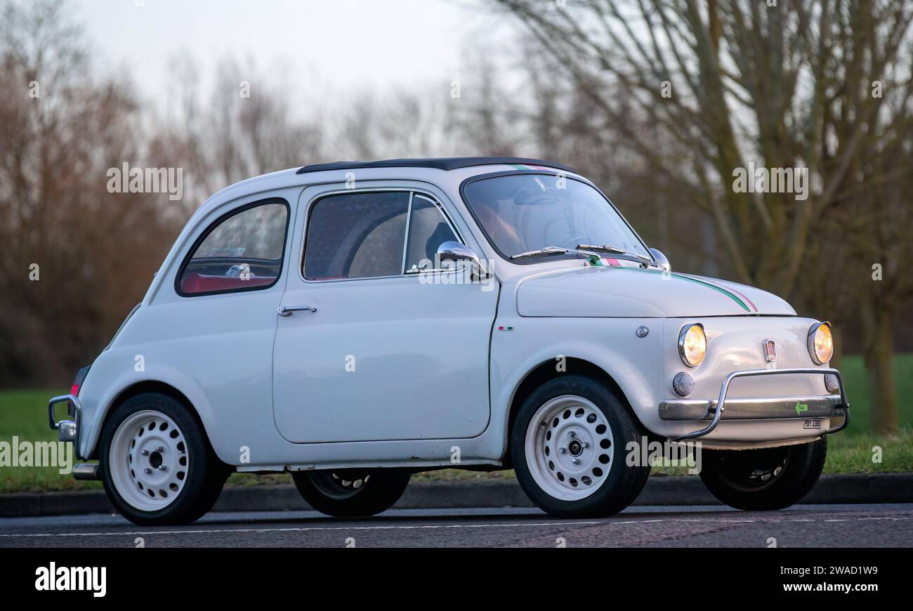 Stony Stratford,UK Jan 1st 2024. 1966 white Fiat 500  car arriving at Stony Stratford for the annual New Years Day vintage and classic vehicle festiva Stock Photo