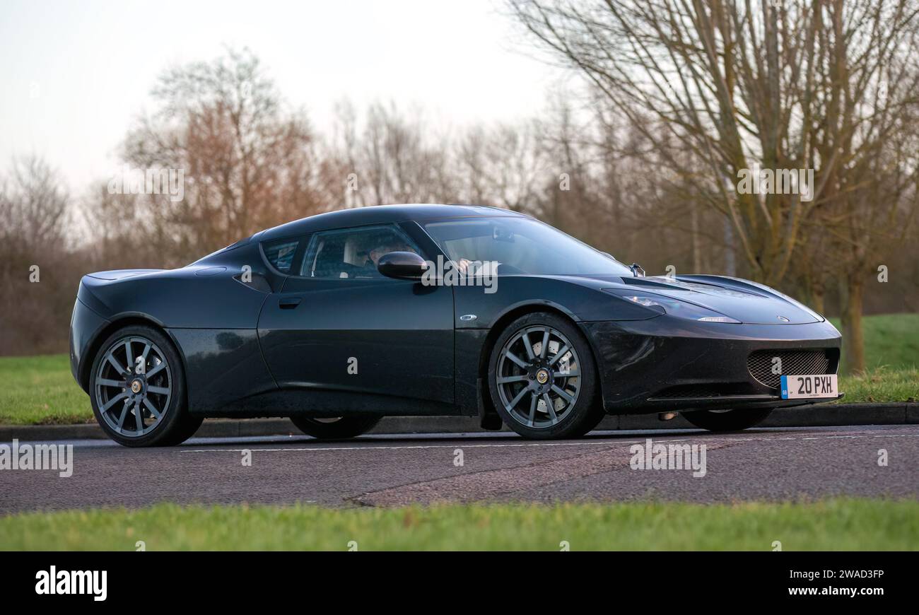 Stony Stratford,UK Jan 1st 2024. 2011 black Lotus Evora car arriving at