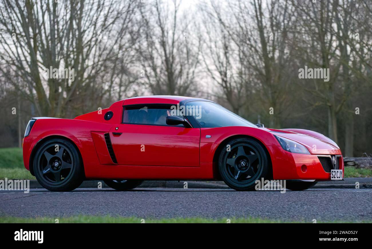 Stony Stratford,UK Jan 1st 2024. 2005 red Vauxhall VX220 car arriving