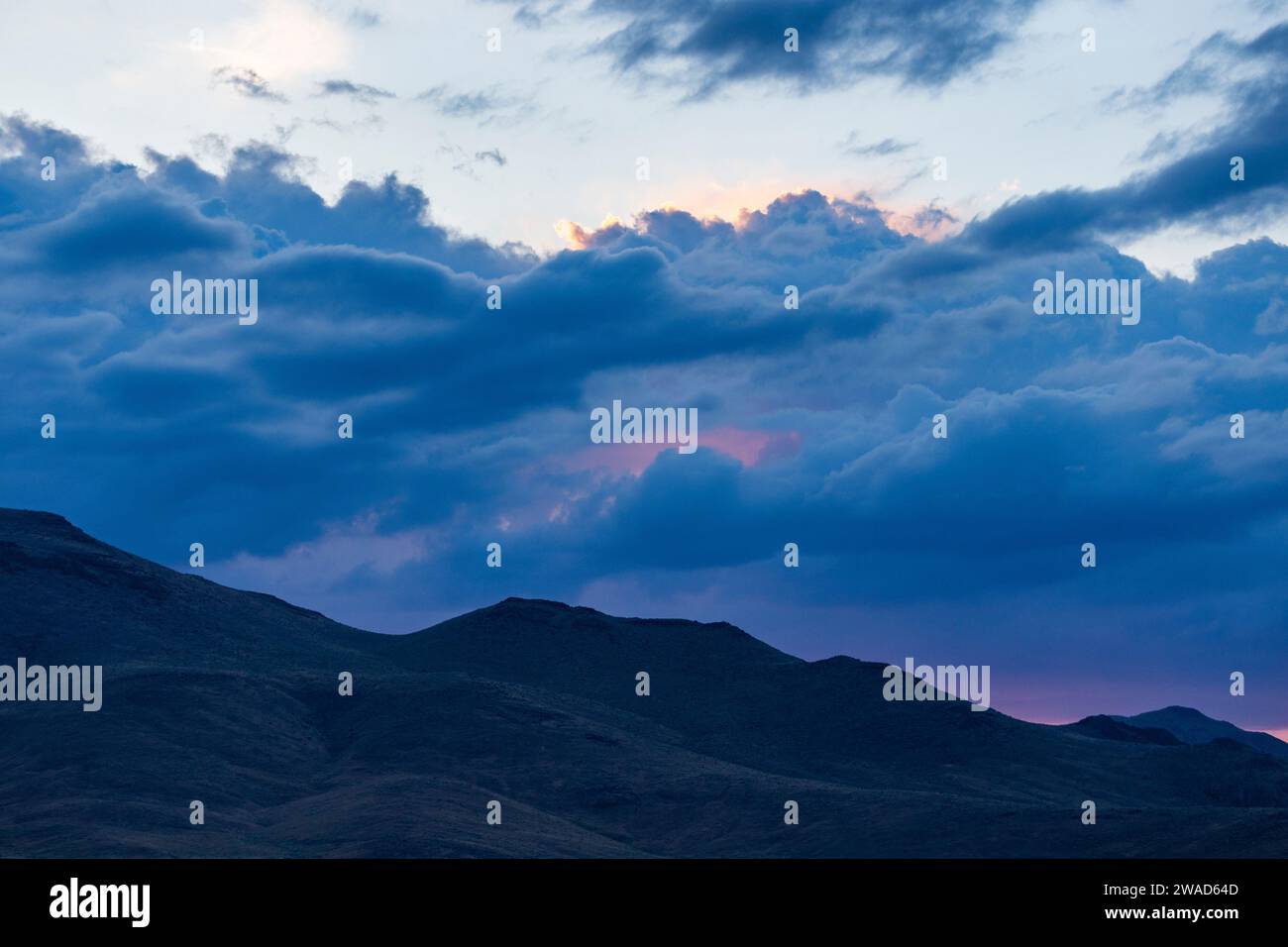 Beautiful dawn over silhouettes of mountains Stock Photo