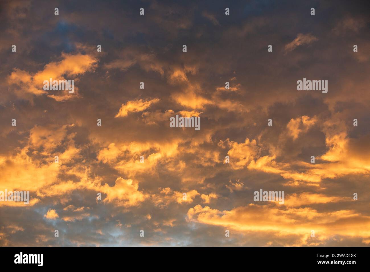 Clouds illuminated by setting sun Stock Photo