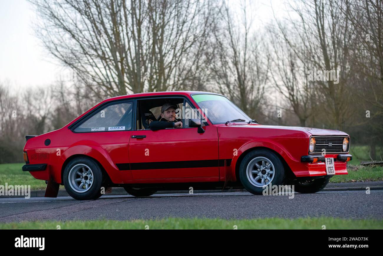 Stony Stratford,UK Jan 1st 2024. 1977 red Ford Escort car arriving at