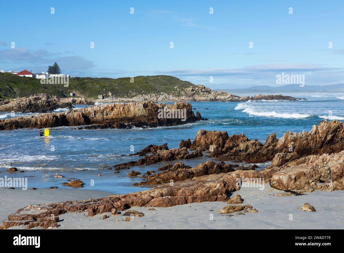 South Africa, Hermanus, Rocky coast and Kammabaai Beach at sunny day Stock Photo