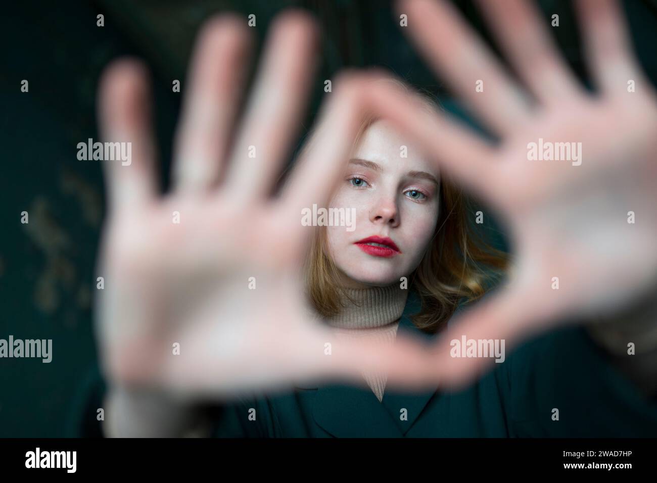 Portrait of teenage girl (16-17) making finger frame Stock Photo - Alamy