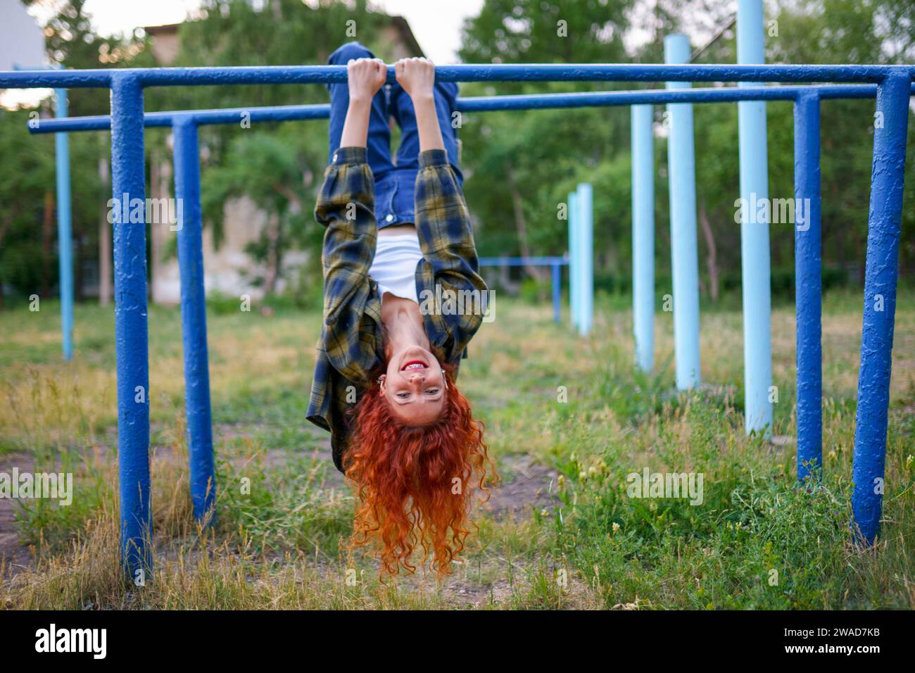 Woman hanging upside down on hi-res stock photography and images - Alamy