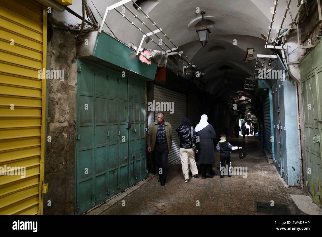 Jerusalem 3rd Jan 2024 People Walk Past Closed Stores In Jerusalem S   Jerusalem 3rd Jan 2024 People Walk Past Closed Stores In Jerusalems Old City Jan 3 2024 A Strike On Wednesday Took Place Here After Hamas Deputy Chief Saleh Al Arouri Was Killed In An Israeli Airstrike In Beirut Credit Muammar Awadxinhuaalamy Live News 2WAD8MP 