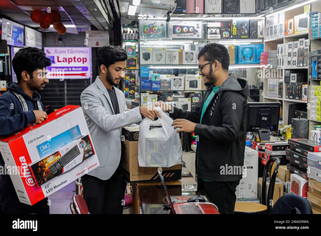 Customers buying computers and other digital accessories at a computer market in Dhaka
