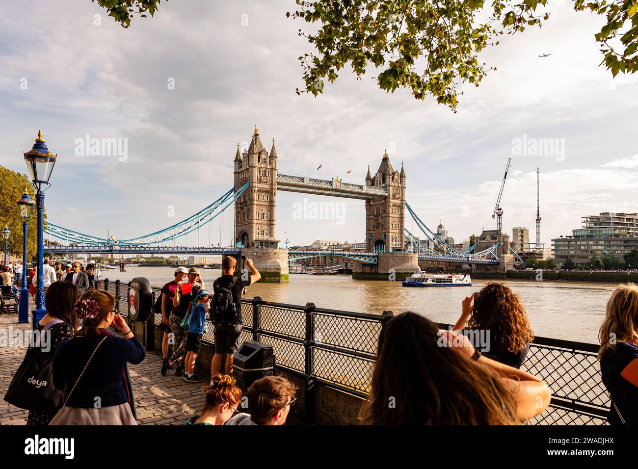 London, England, 07th October 2023: Many tourists at sightseeing near the famous Tower Bridge. Stock Photo
