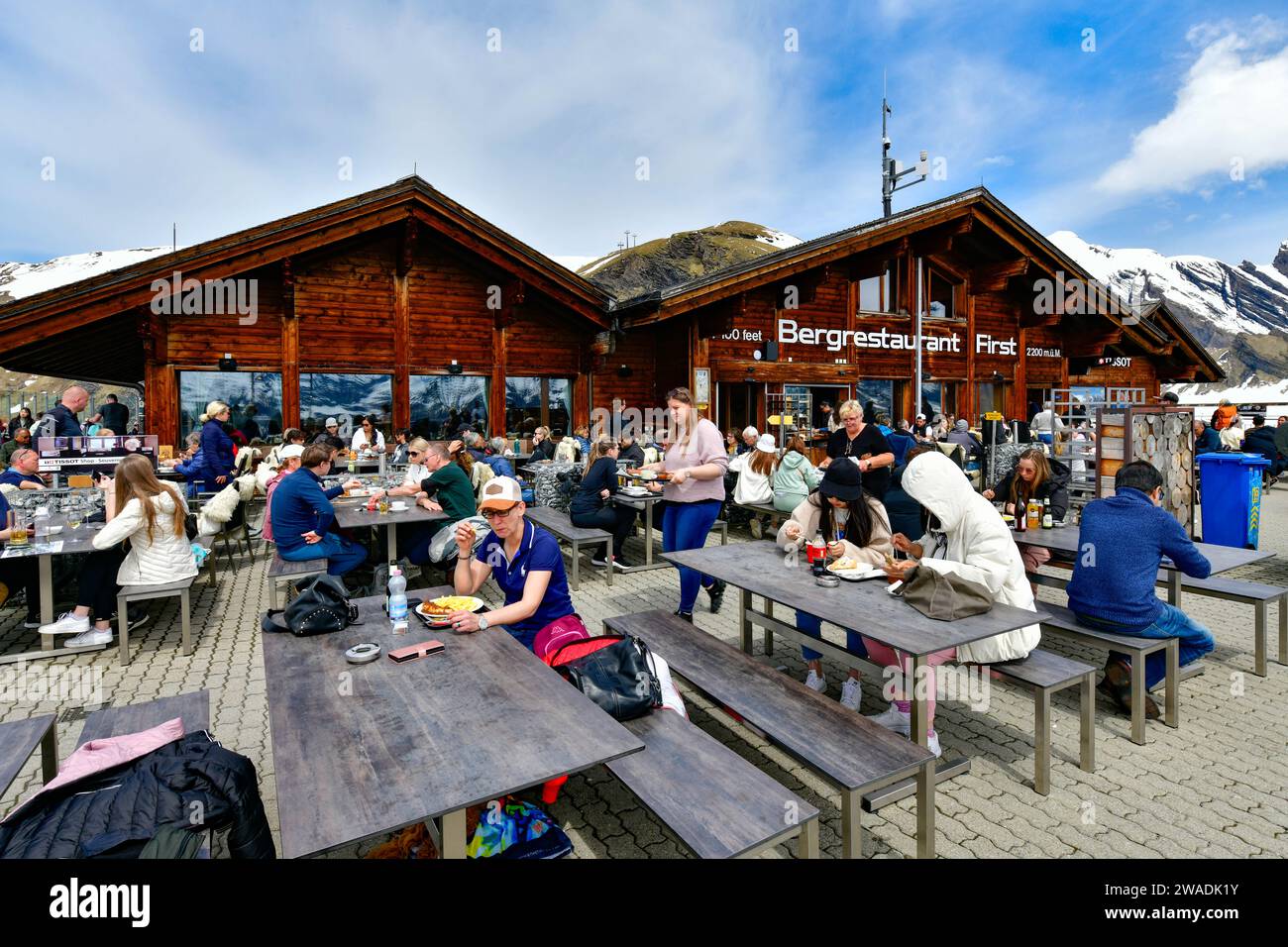 Grindelwald May 23, 2023 Tourist at the restaurant terrace on sky cliff walk at First peak of