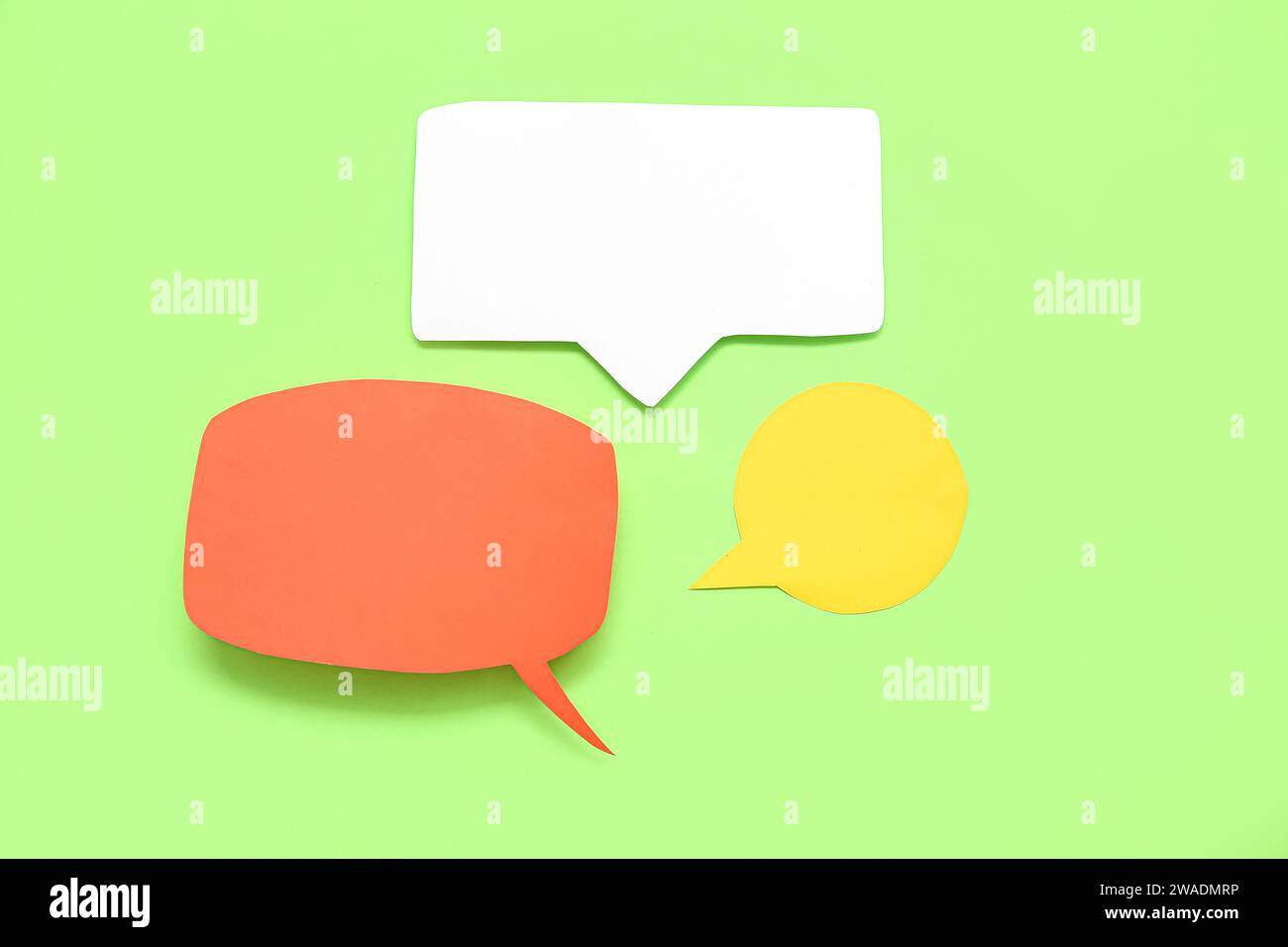 Blank speech bubbles on green background Stock Photo
