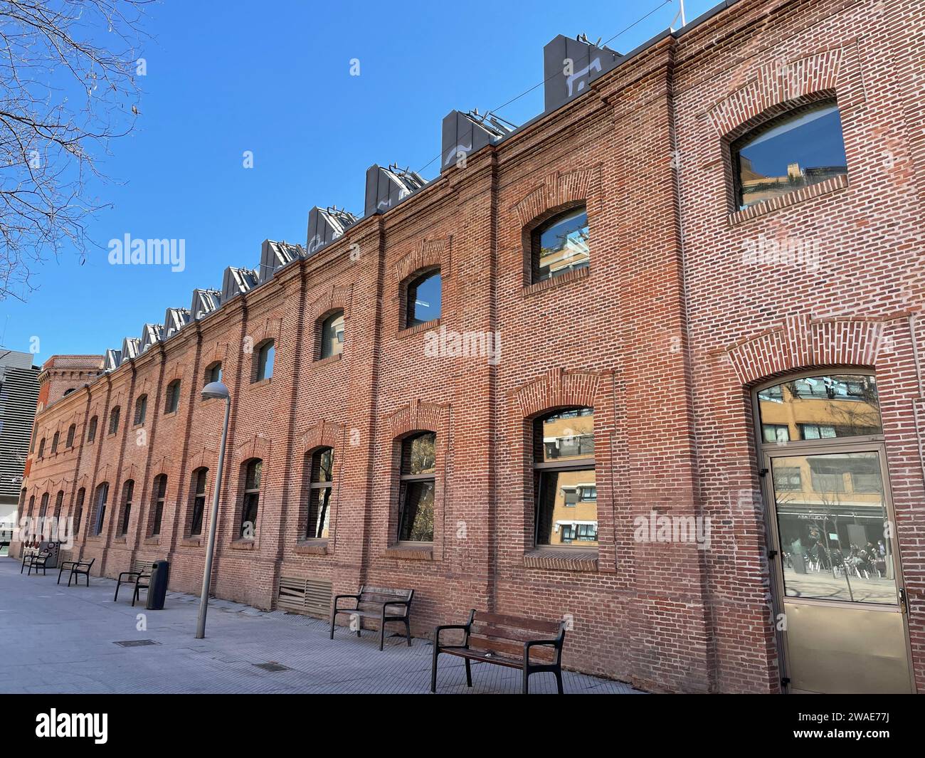 The old factory enhanced as a public services organism in Madrid Stock Photo