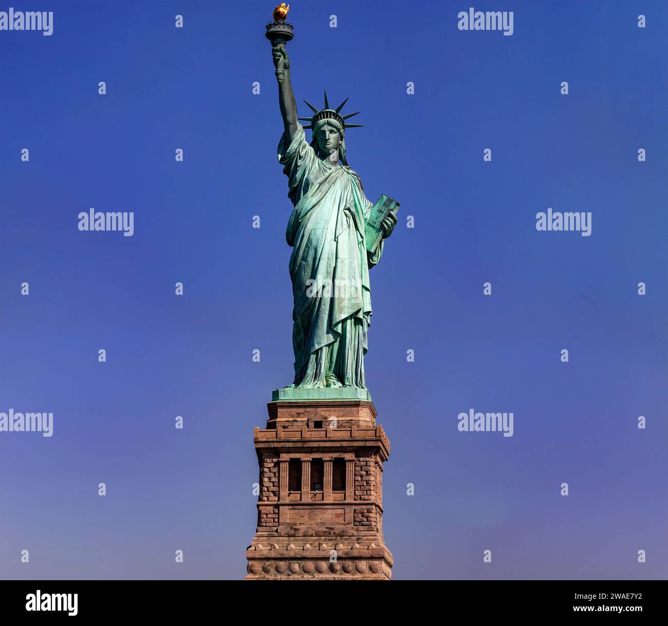 New York, USA; June 1, 2023: The Statue of Liberty on the pedestal in Manhattan is the symbol of democracy and freedom throughout the world. Stock Photo