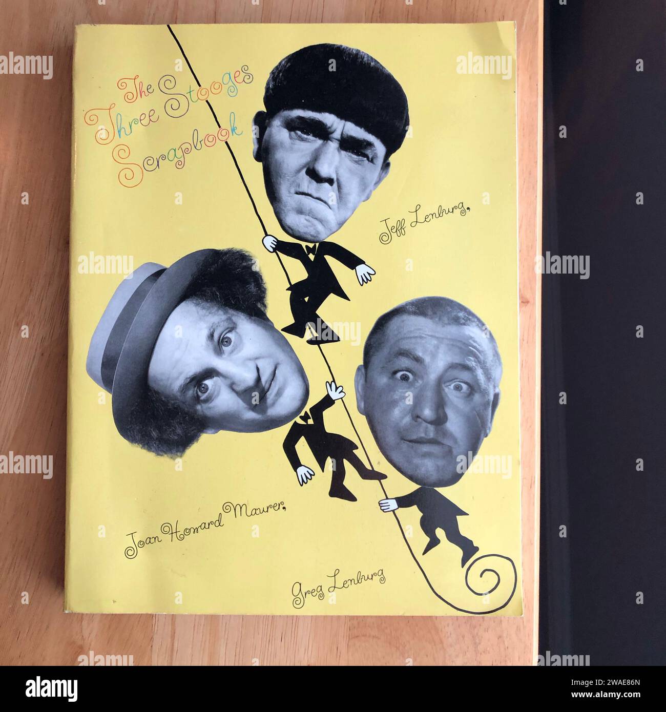 A closeup shot of the cover of the Three Stooges Scrapbook with Moe, Larry and Curly Stock Photo
