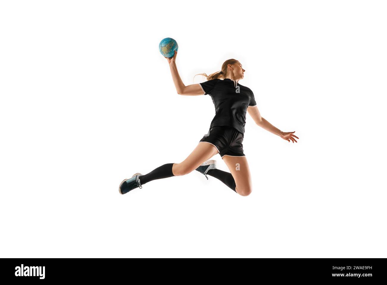 Caucasian woman honing her handball skills, showcasing precision in ...