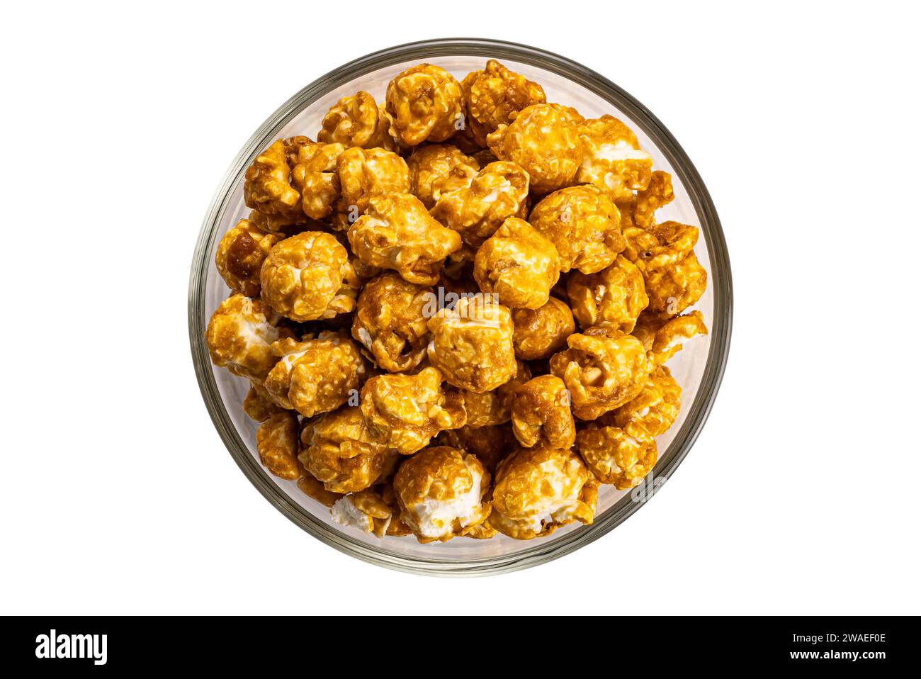 Top view caramel almonds in transparent glass bowl isolated on white ...