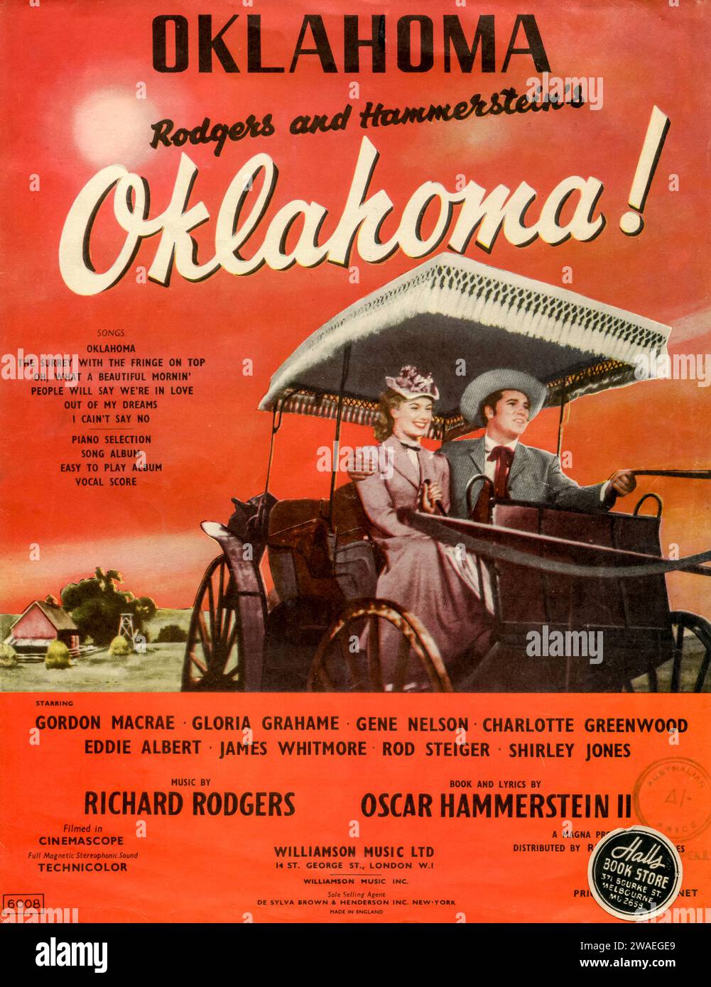 An Australian publication sold by Halls Bookstore in Melbourne, of the Broadway and Hollywood musical, Oklahoma! The musical was written by Richard Rogers and Oscar Hammerstein II based on the 1931 play, Green Grow the Lilacs by Lynn Riggs. It was first performed in 1943 on Broadway to great success and later made into a motion picture film Stock Photo