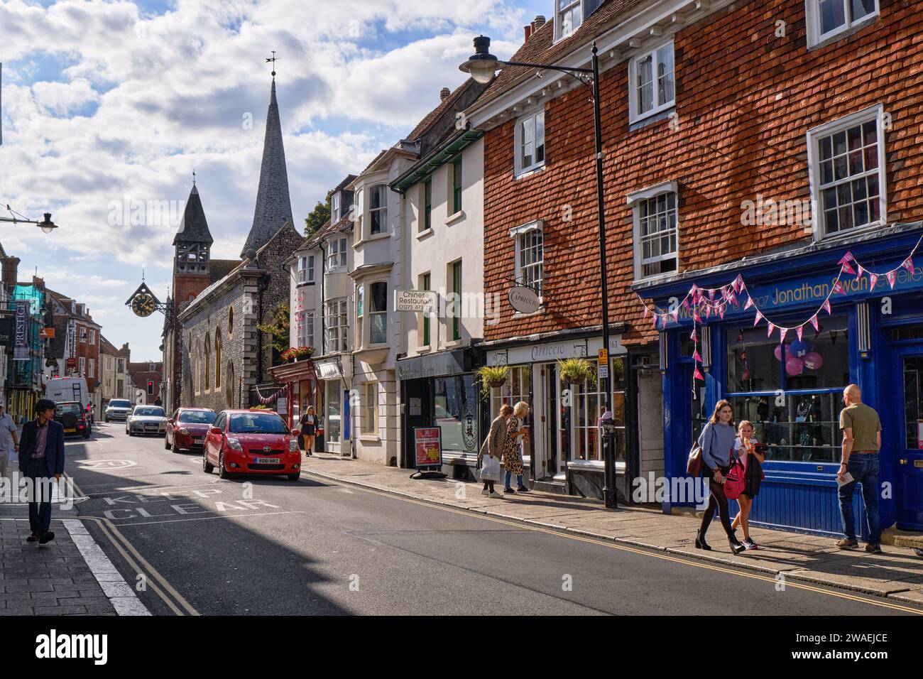 High Street, Lewes towards to city center, with shops and pedestrians. Lewes, UK, Stock Photo