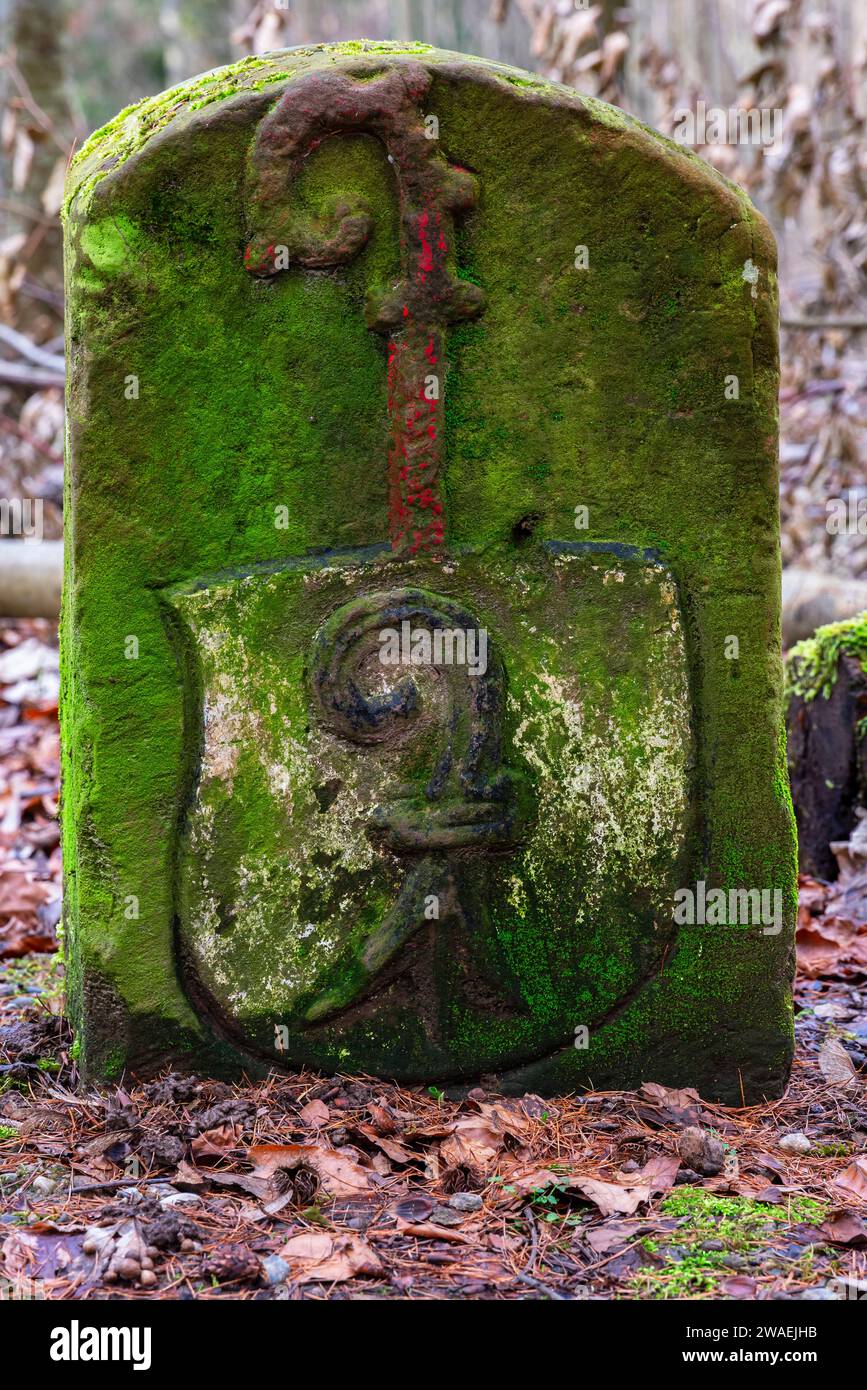 Swiss side of  so-called Bishop's stone nr 61 (Bchofstein) dates back to 1491. The stone red shows bishop’s crook and black bishop’s crook below. Stock Photo