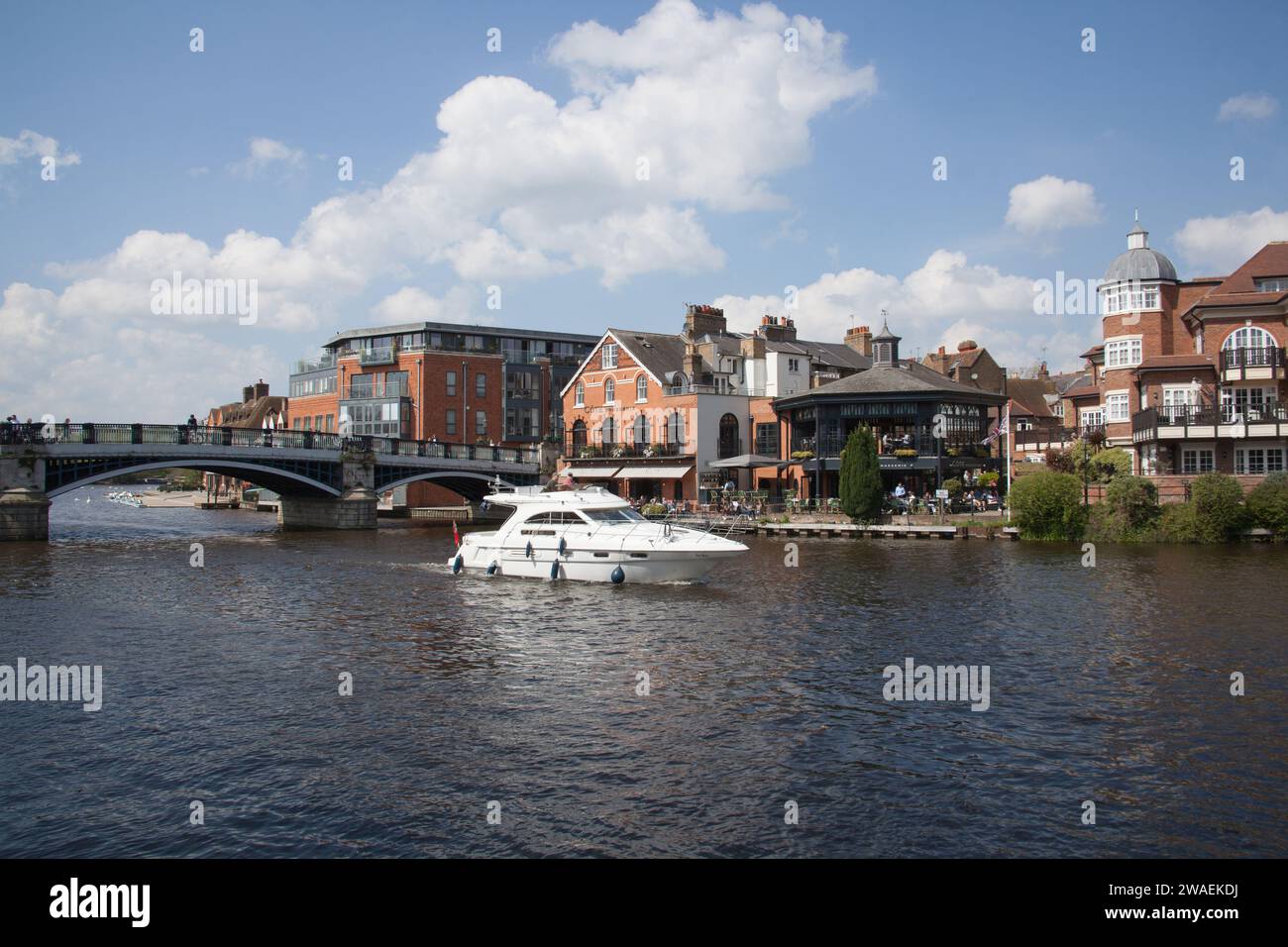 A small boat on the Windsor Eton Bridge, over the River Thames between Windsor and Eton in the UK Stock Photo