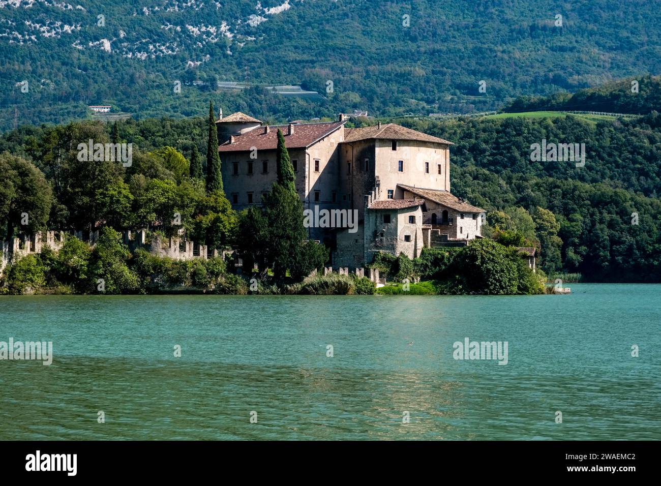The castle Castel Toblino, built in the 12th century, situated on a peninsula of the lake Lago di Toblino. Stock Photo