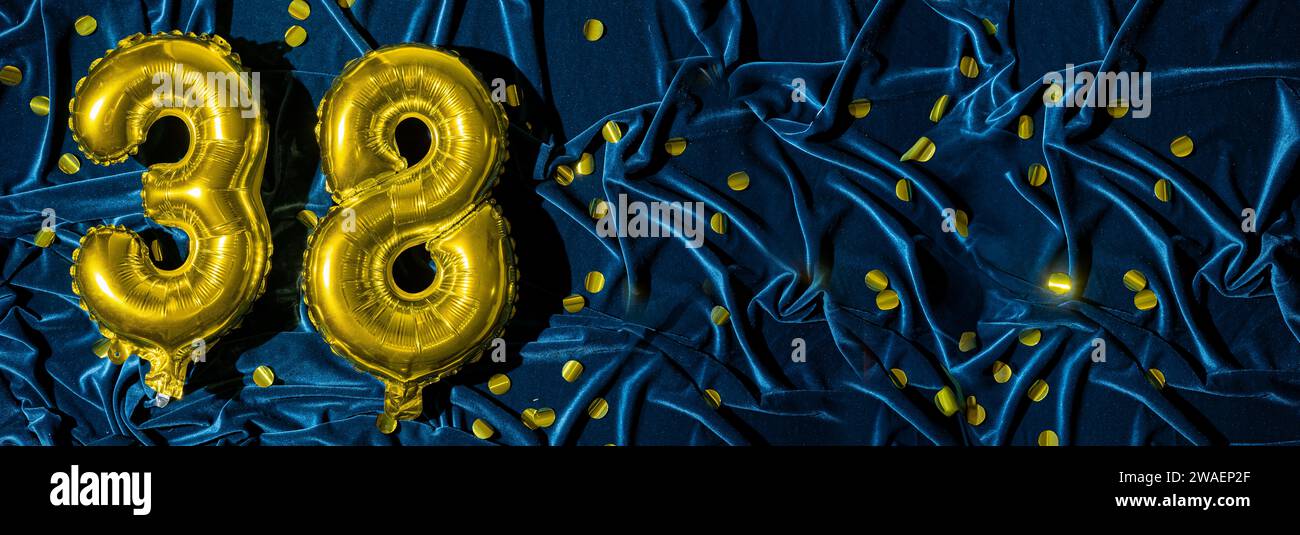 Number Thirty Eight Gold Foil Balloon Number On Blue Velvet Background Number Thirty Eight Gold Foil Balloon Number On Blue Velvet Background