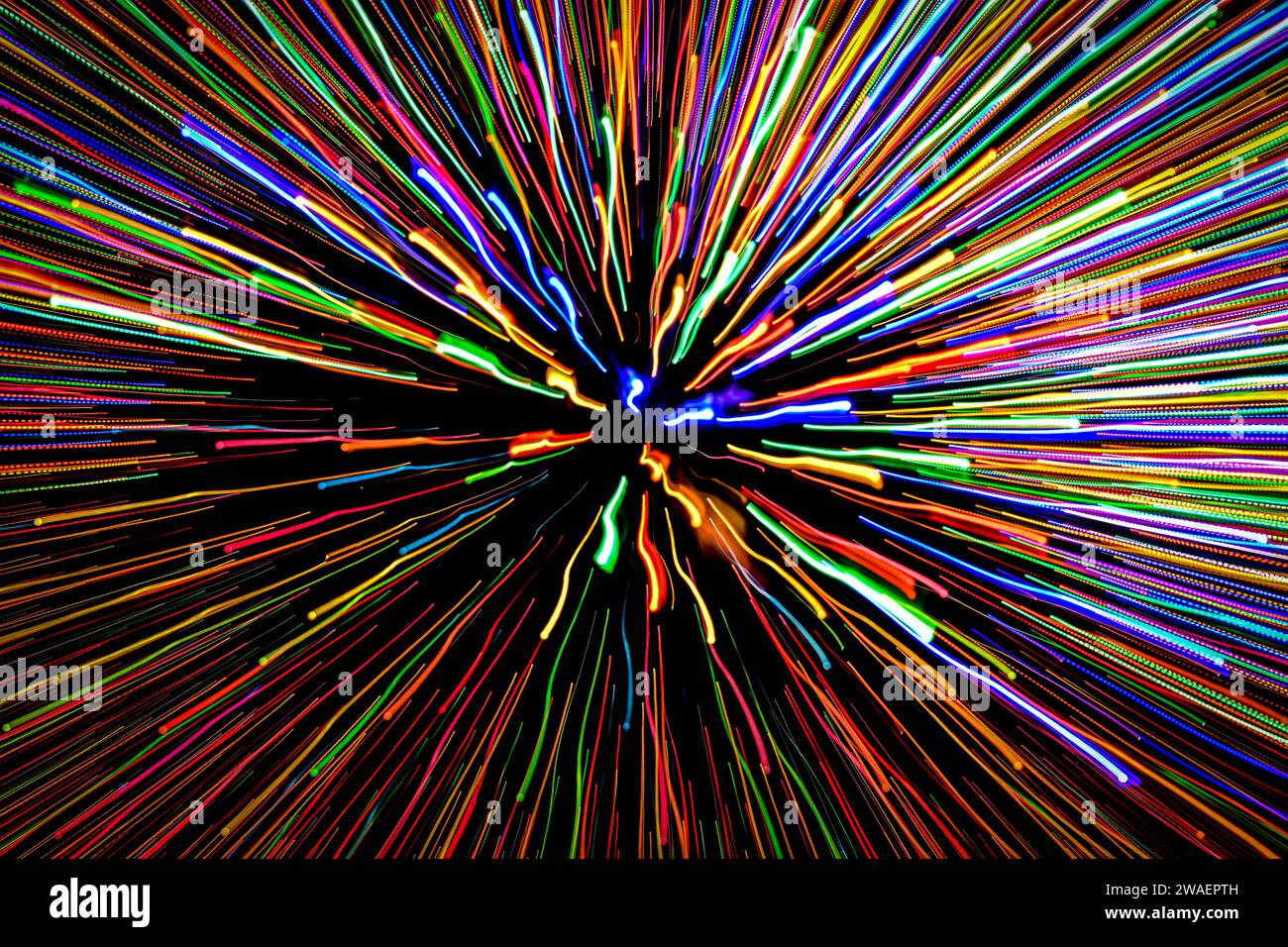 The Christmas lights zoomed in during exposure to give a hyperspace look Stock Photo