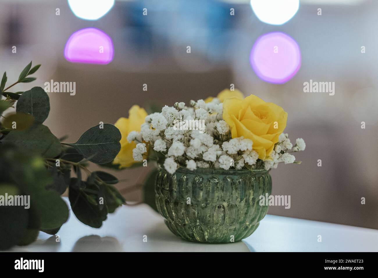 A glass vase filled with an arrangement of colorful flowers Stock Photo ...