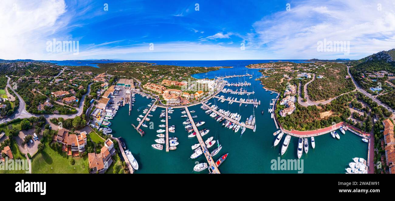 Italy, Sardegna island. Luxury resort  town Porto Cervo. Marina with sailing boats, aerial drone video view Stock Photo
