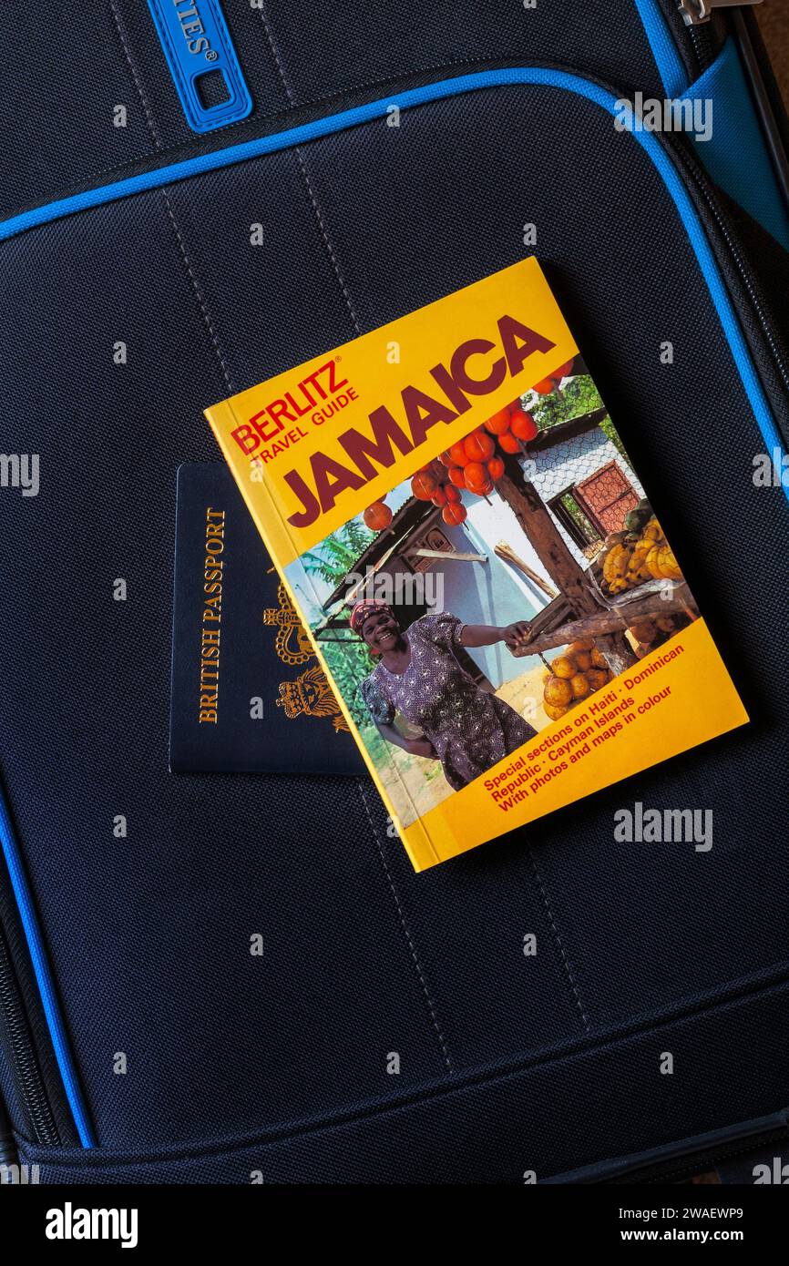 Jamaica Berlitz Travel Guide book with British passport on suitcase - holiday vacation travel concept Stock Photo