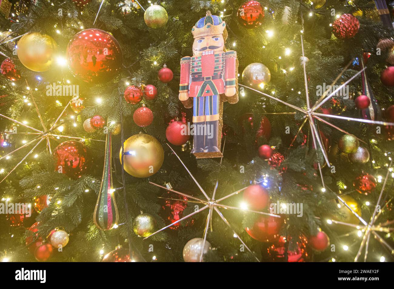 Happy New Year 2024, Christmas tree in Kyiv Retroville Mall, holidays celebrated inspite of very damaging and bloody Ukraine-Russia conflict. Stock Photo