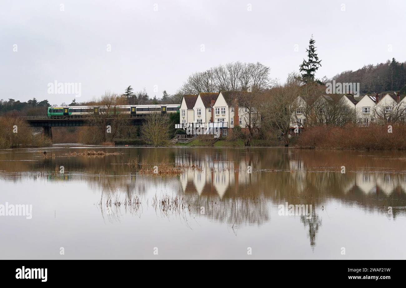 A view of flooding around the River Arun in Pulborough, West Sussex. The Met Office issued a yellow weather warning from 12pm on Thursday with rainfall expected to travel in a north-east direction across the south of England, lasting until 3am on Friday. Picture date: Thursday January 4, 2024. Stock Photo