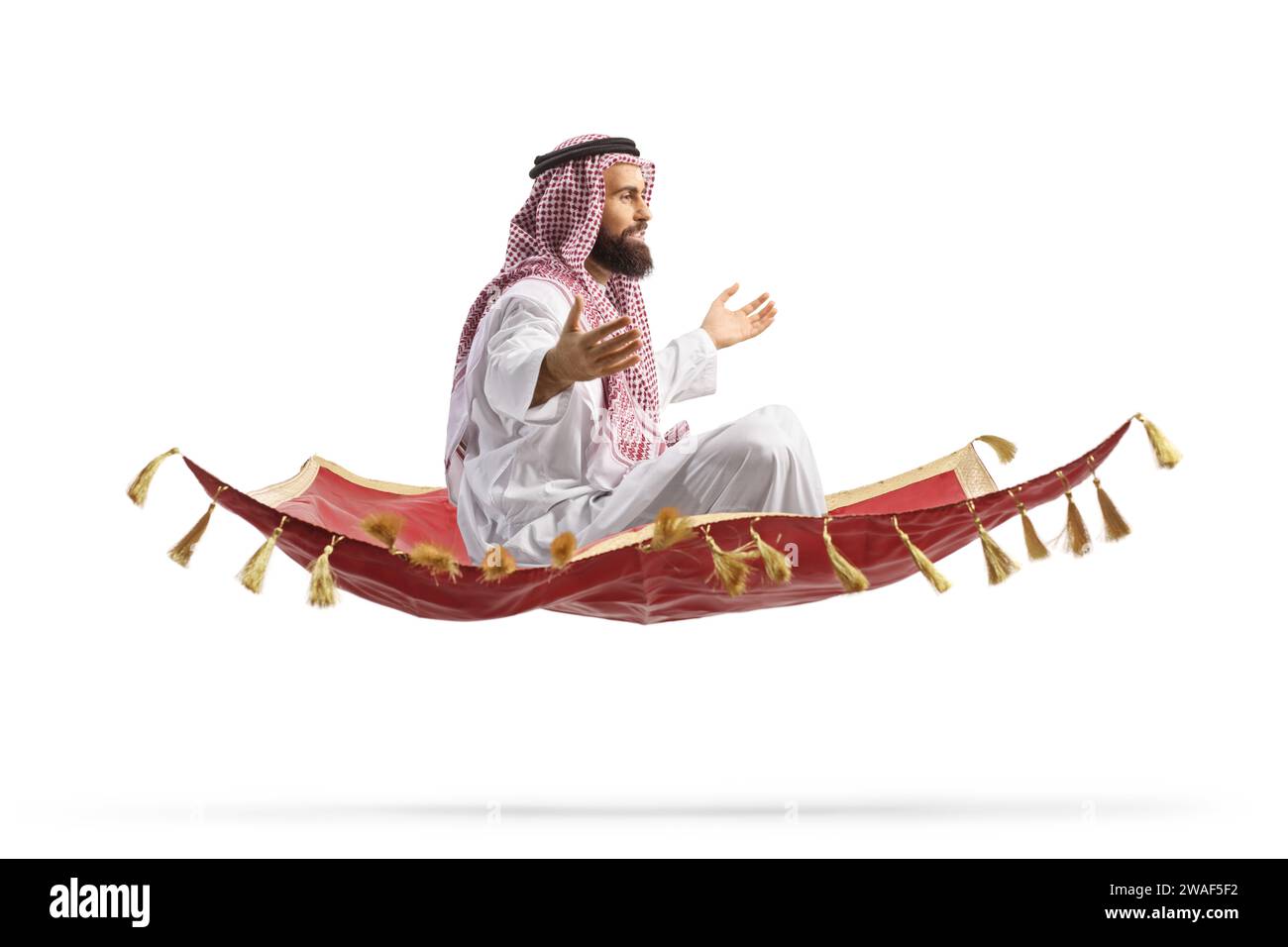 Saudi arab man sitting on a magic carpet and flying isolated on white background Stock Photo