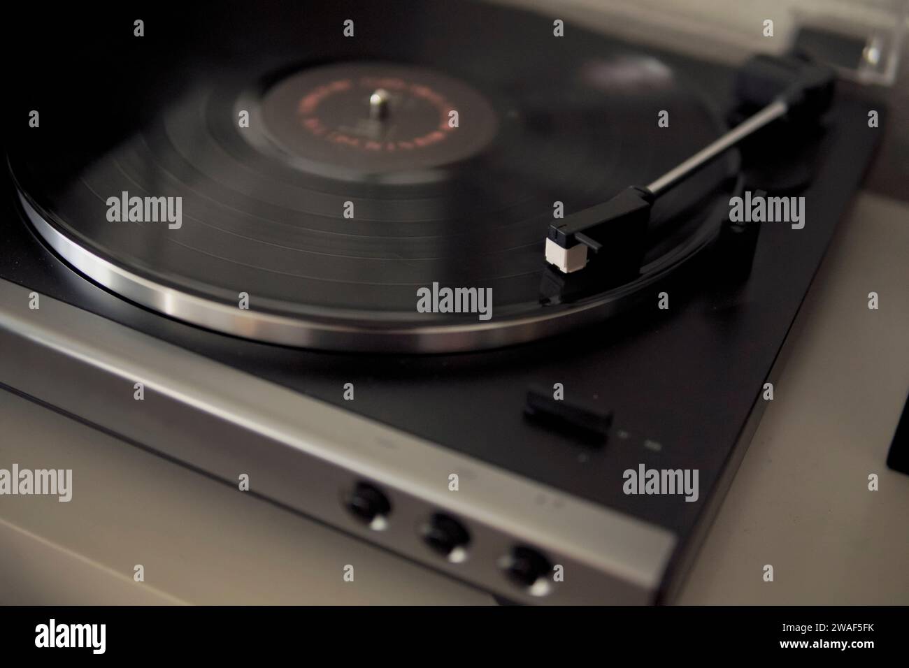 turntable with vinyl playing indoors Stock Photo