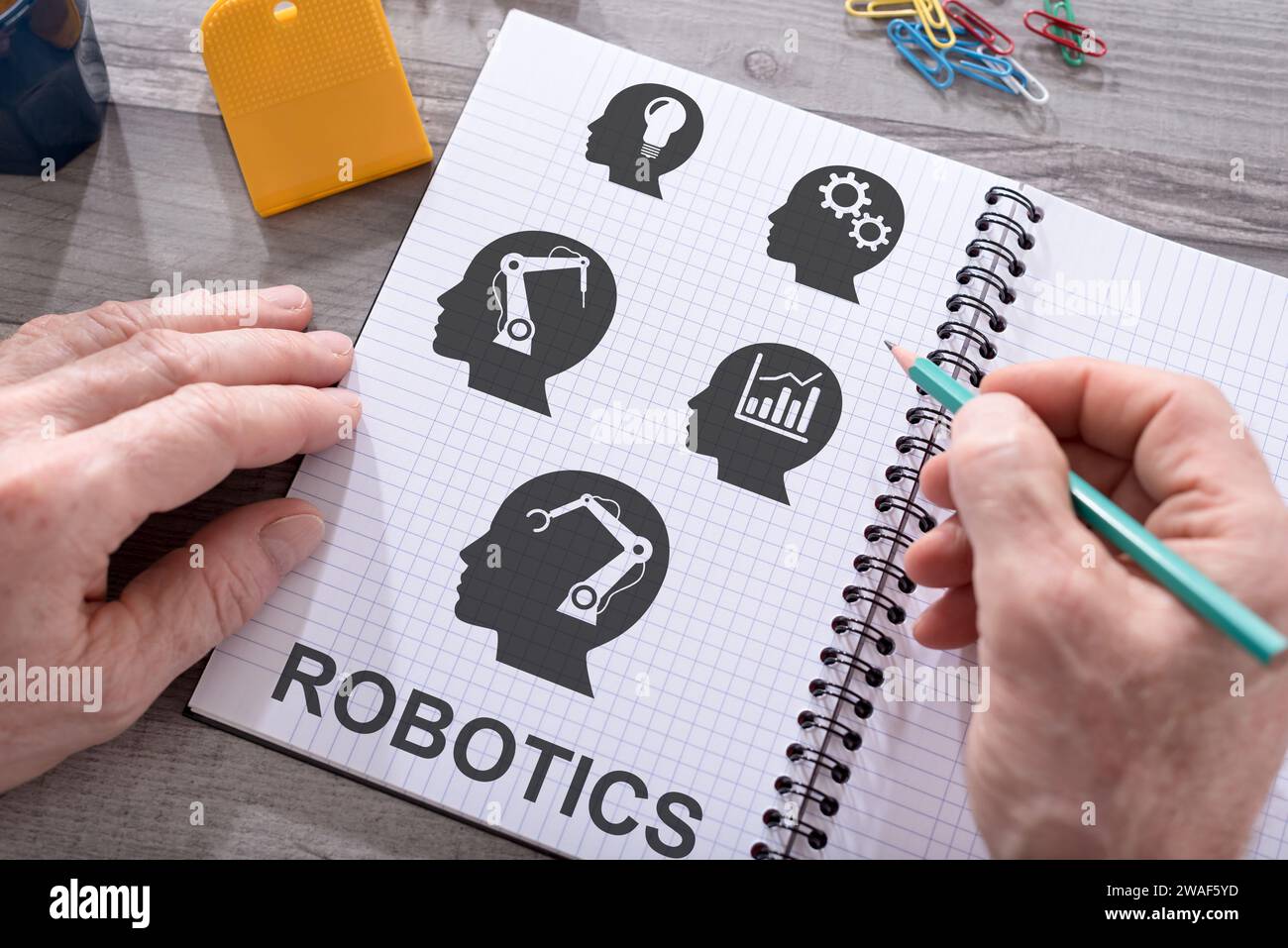 Robotics concept drawn on a notepad placed on a desk Stock Photo