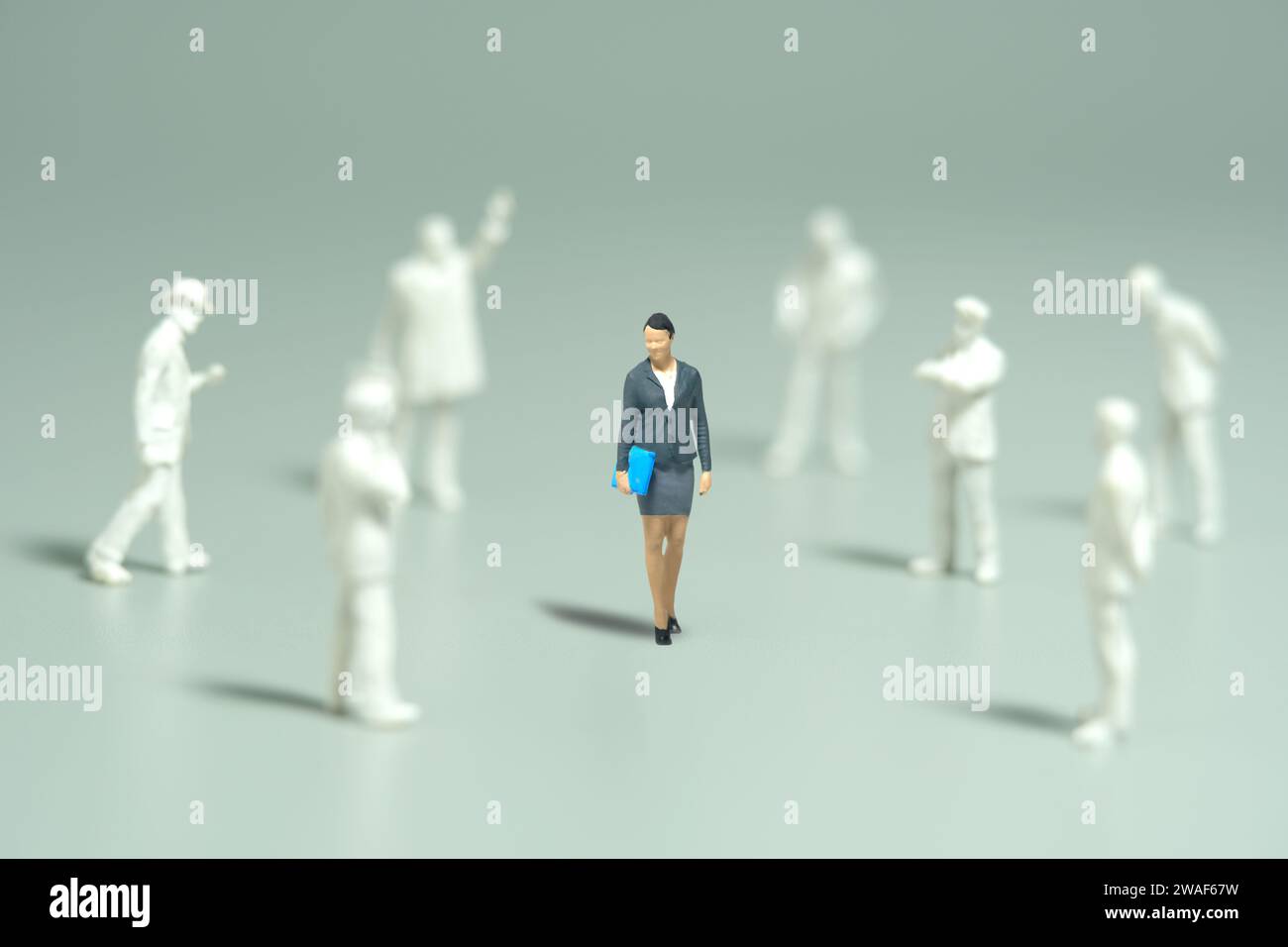 Miniature people toy figure photography. Women empowerment concept. A