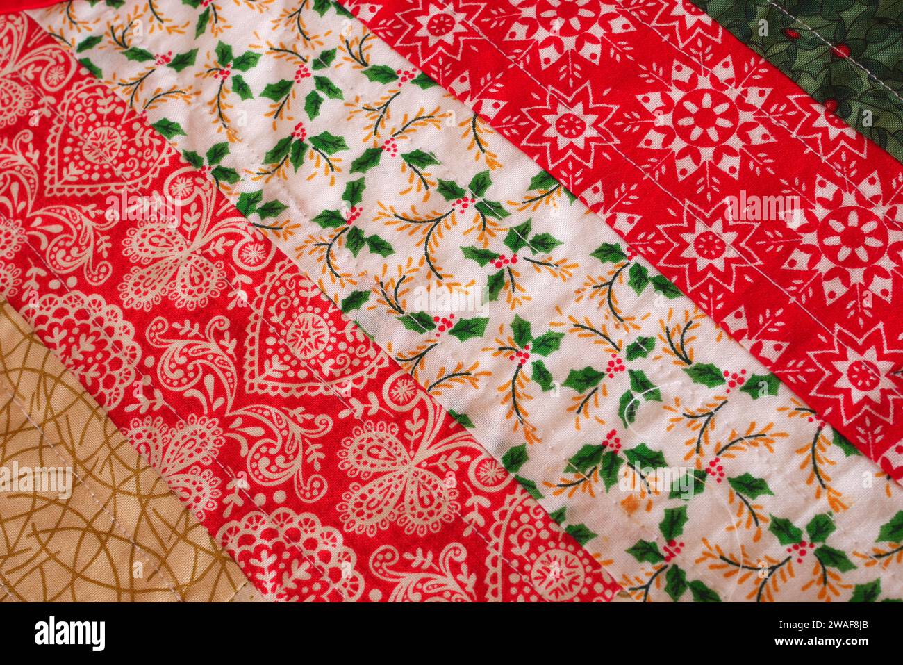 Detail of a hand-stitched Christmas table runner Stock Photo