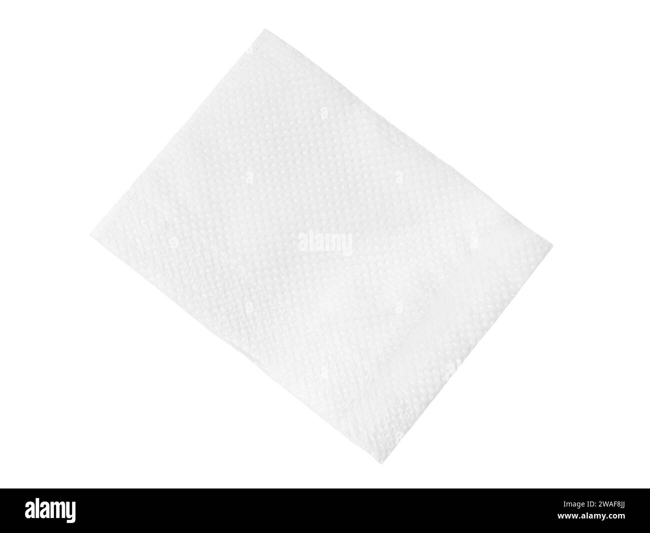 Top view of single folded white tissue paper or napkin is isolated on white background with clipping path. Stock Photo