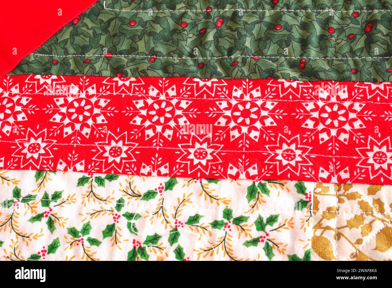 Detail of a hand-stitched Christmas table runner Stock Photo
