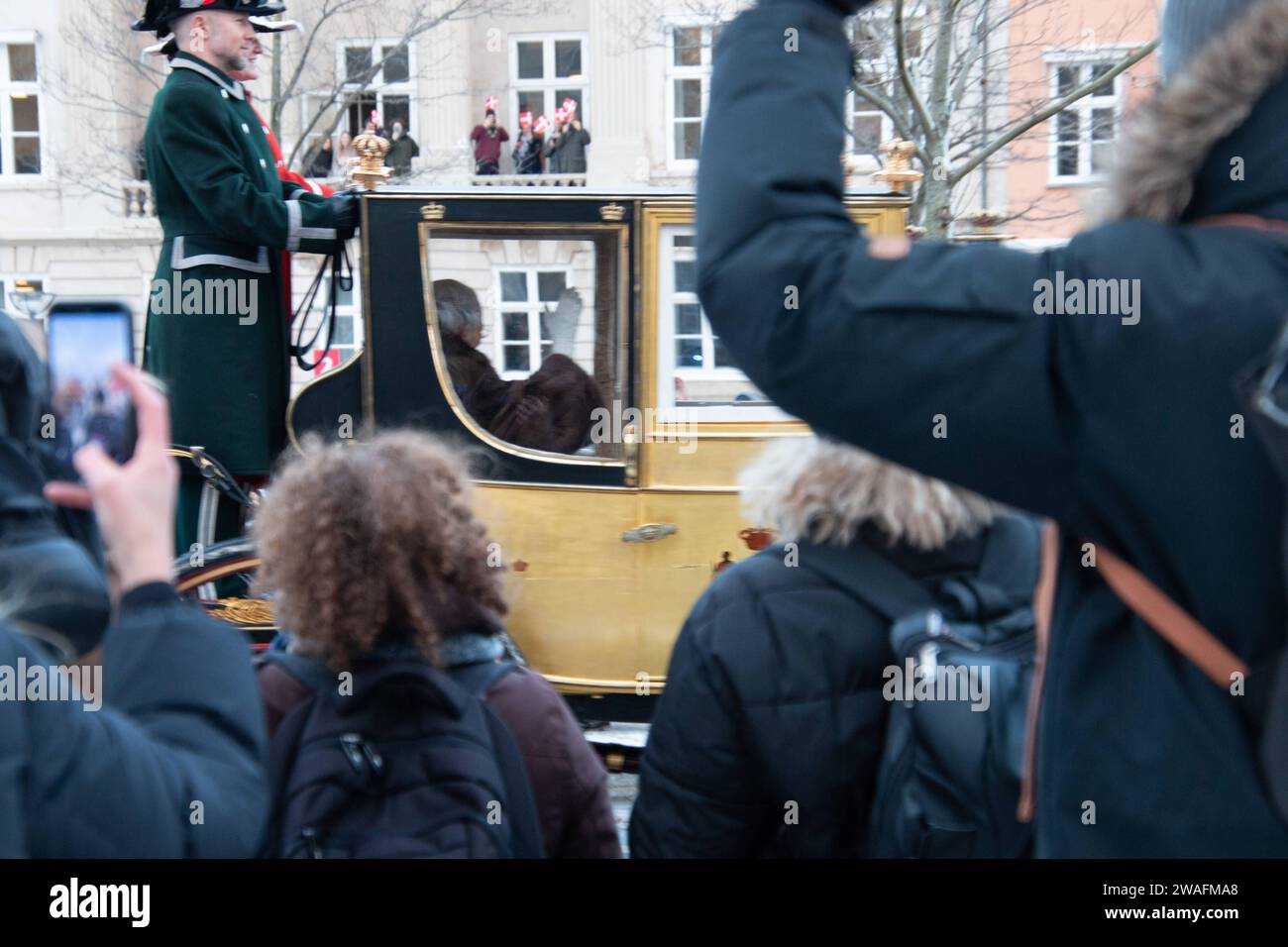 The Queen rides in the Gold Coach, escorted by the Guard Hussar