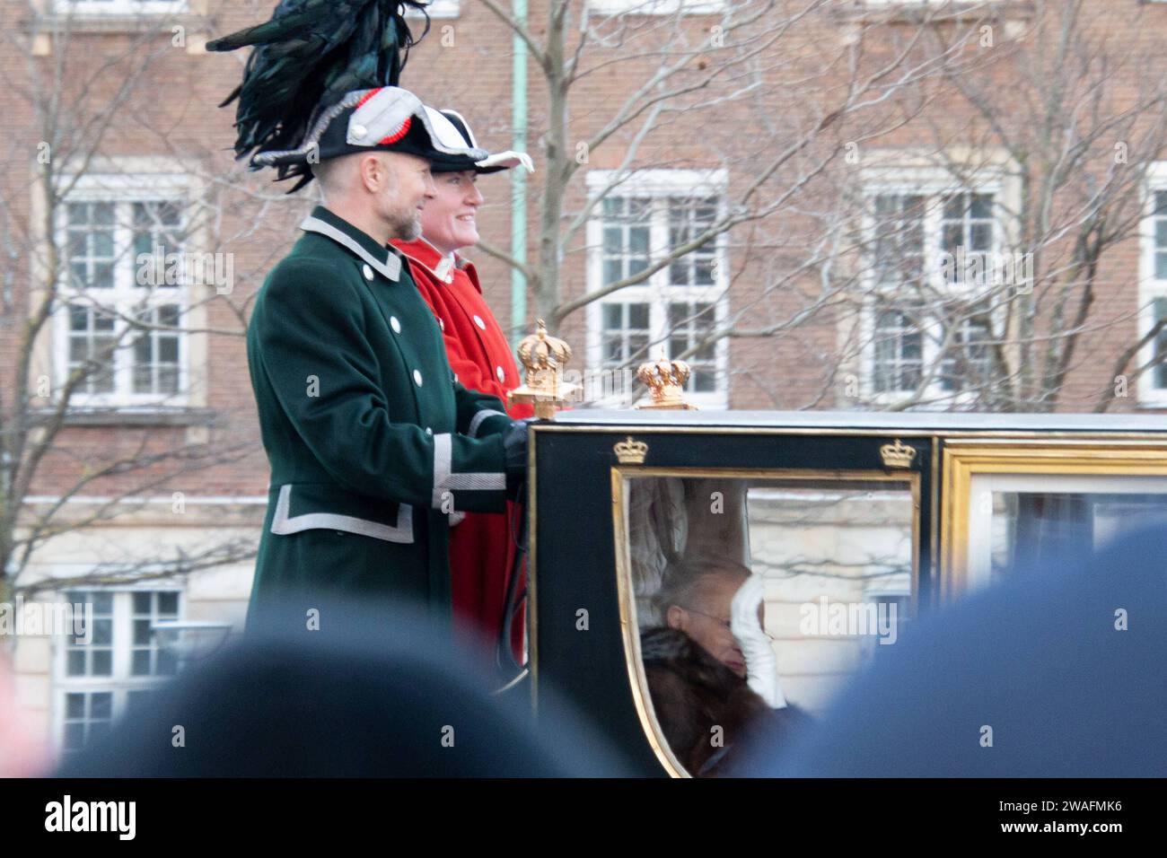 The Queen rides in the Gold Coach, escorted by the Guard Hussar