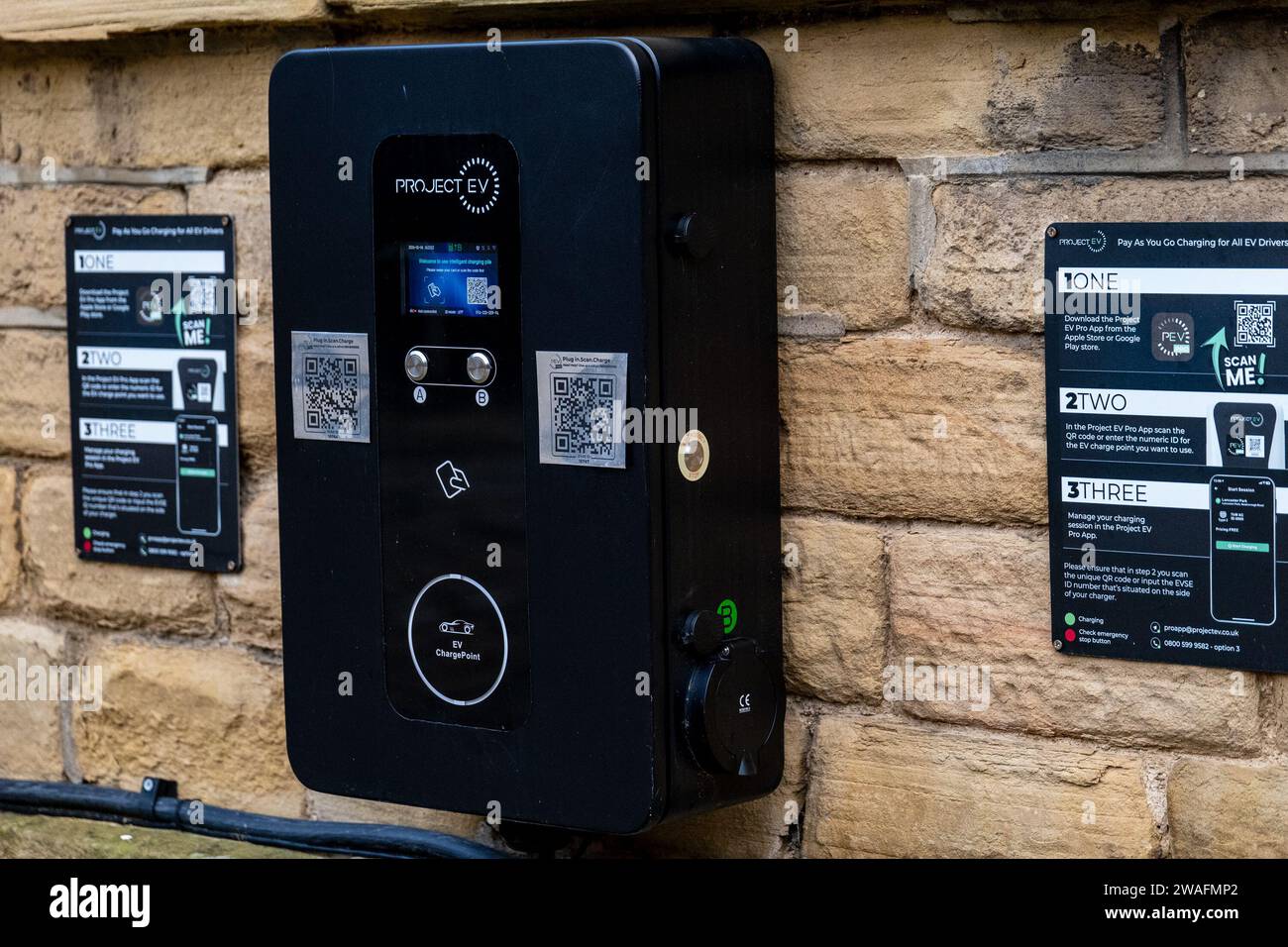 ProjectEV wall mounted electric vehicle chargers at Salts Mill. EV infrastructure for charging electric cars. Stock Photo