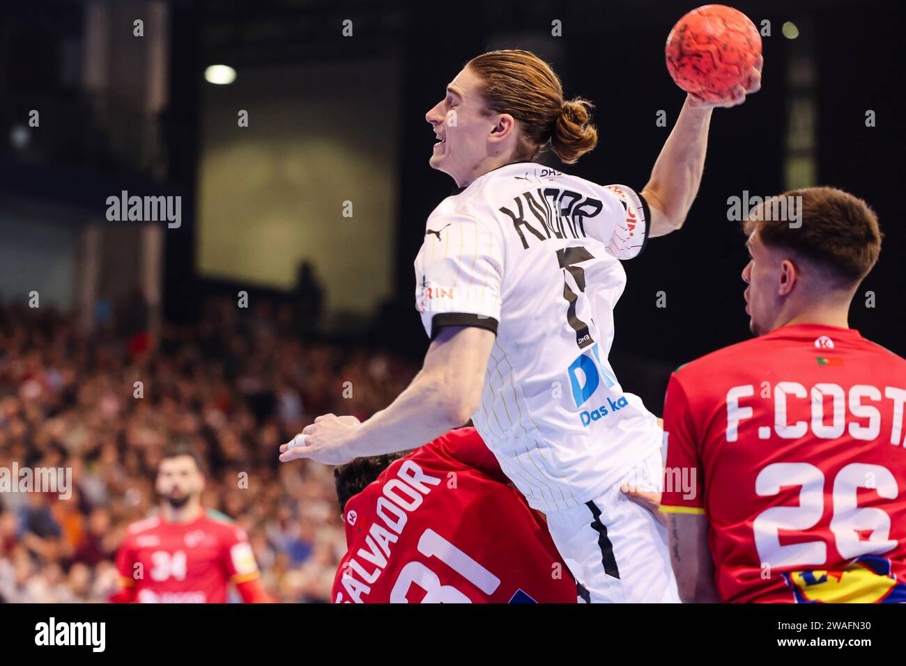 Flensburg, Germany. 04th Jan, 2024. Handball: International match, Germany - Portugal. Germany's Juri Knorr (center) prevails against Portugal's Francisco Costa (right) and Salvador Salvador (left). Credit: Frank Molter/dpa/Alamy Live News Stock Photo